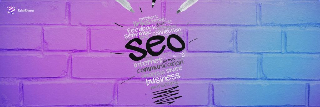 SEO word cloud in the shape of a lightbulb on a gradient brick wall background, symbolizing strategic ideas for search engine optimization